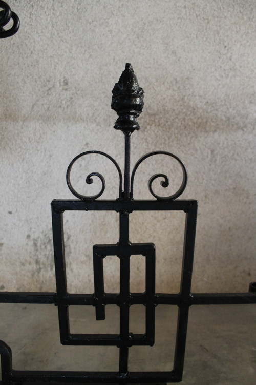 Pair of large wrought iron gallows with Louis XVI style scrollwork, 20th century