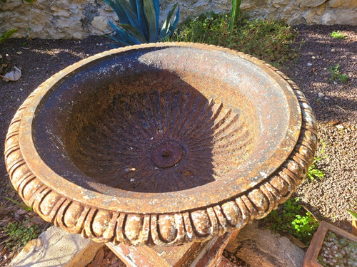 Set of 4 large cast iron garden vases on terracotta bases, 19th century