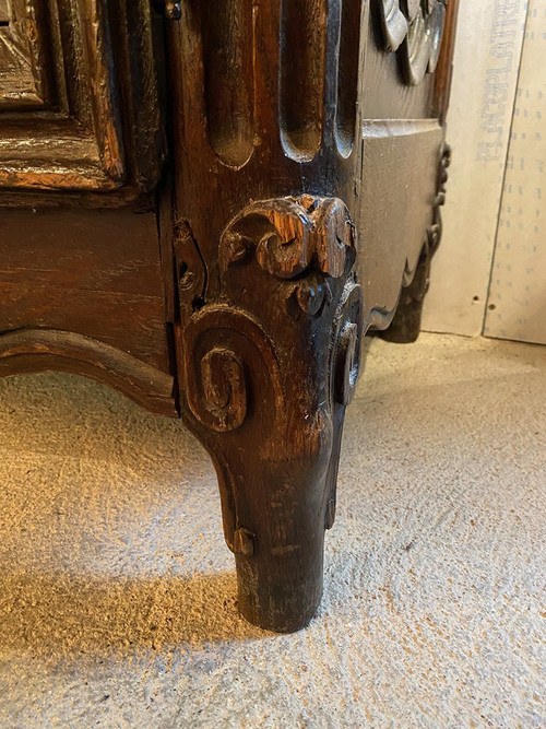 Carved oak cabinet decorated with foliage and flowers, late 18th century