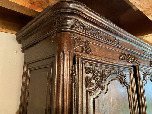 Carved oak cabinet decorated with foliage and flowers, late 18th century