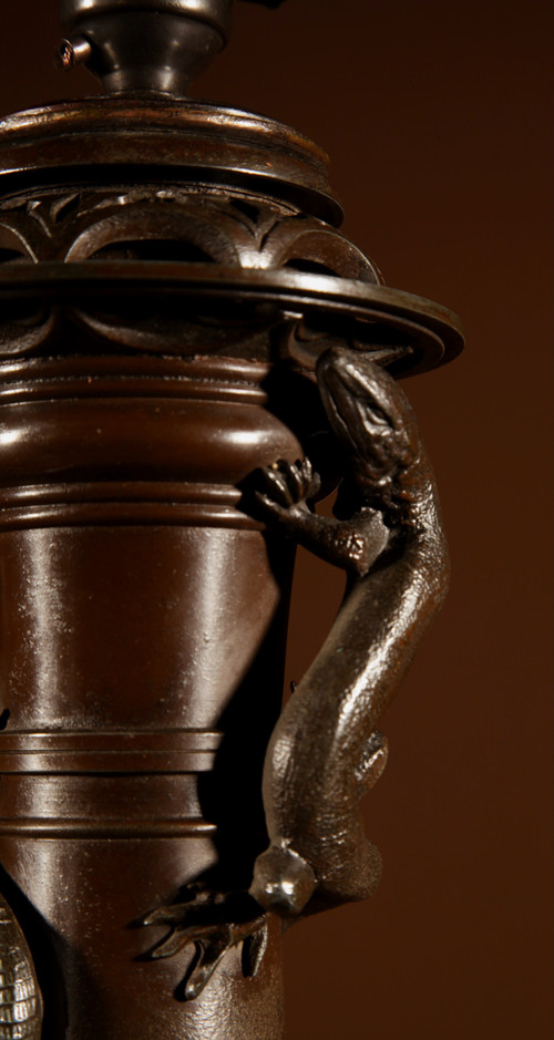  An original French table lamp in white metal with a Chinese patina.