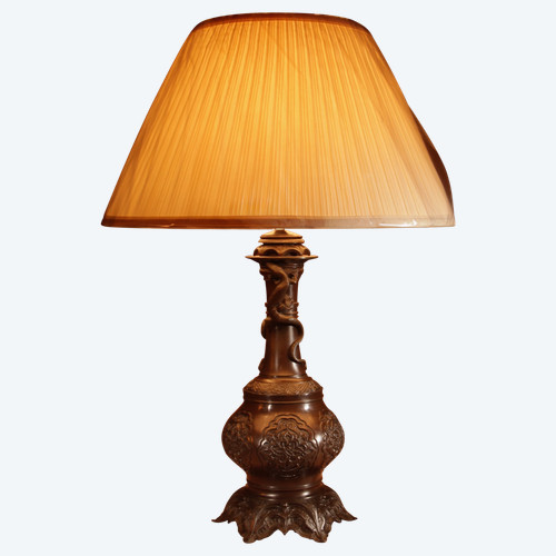  An original French table lamp in white metal with a Chinese patina.