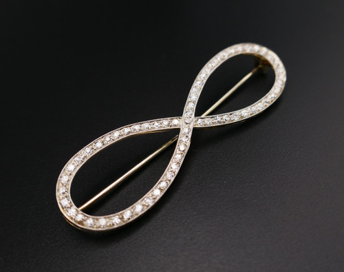 18k white gold and platinum diamond brooch.