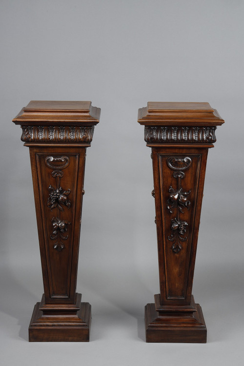 PAIR OF CARVED MOLDED WALNUT SELLETTES WITH FRUIT AND PLANT DECORATIONS