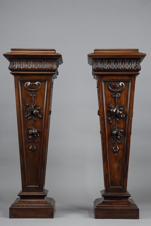 PAIR OF CARVED MOLDED WALNUT SELLETTES WITH FRUIT AND PLANT DECORATIONS