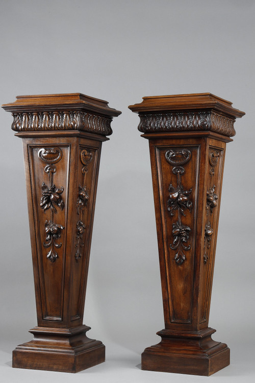 PAIR OF CARVED MOLDED WALNUT SELLETTES WITH FRUIT AND PLANT DECORATIONS