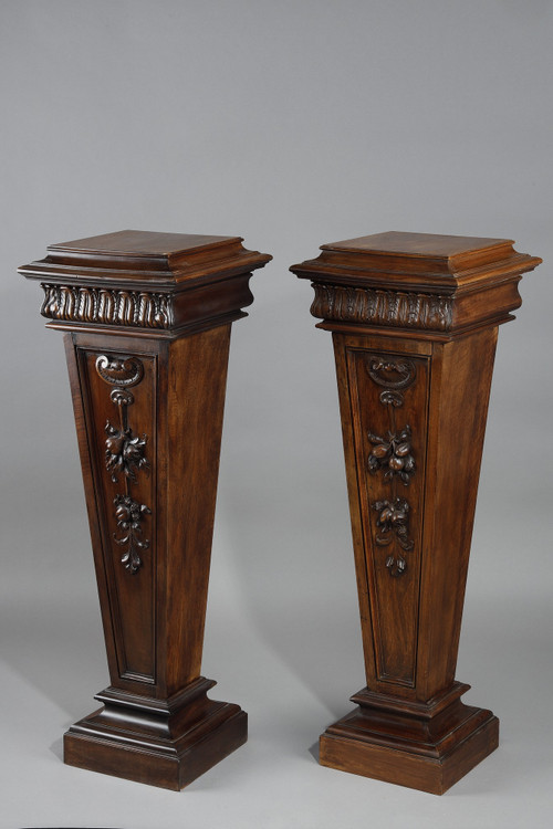 PAIR OF CARVED MOLDED WALNUT SELLETTES WITH FRUIT AND PLANT DECORATIONS