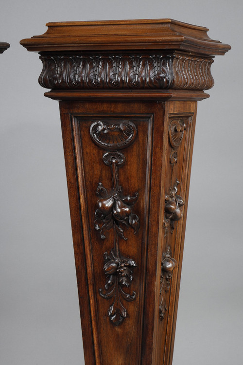 PAIR OF CARVED MOLDED WALNUT SELLETTES WITH FRUIT AND PLANT DECORATIONS