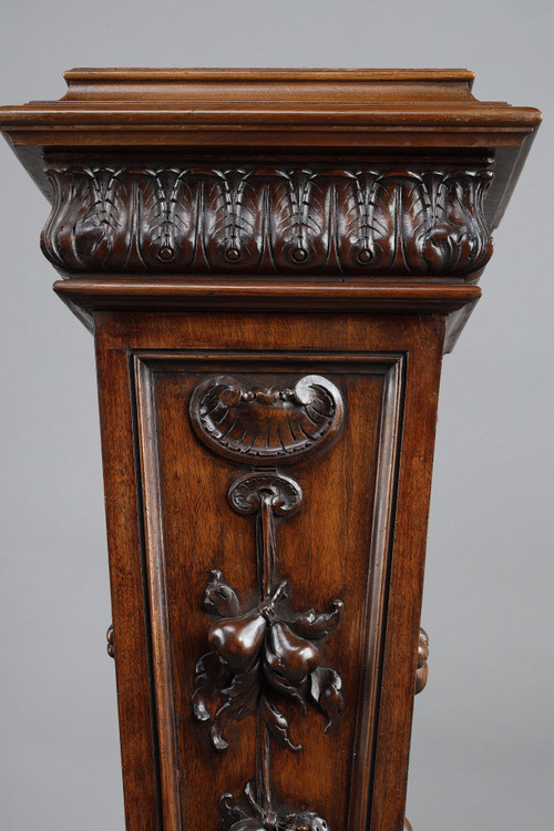 PAIR OF CARVED MOLDED WALNUT SELLETTES WITH FRUIT AND PLANT DECORATIONS