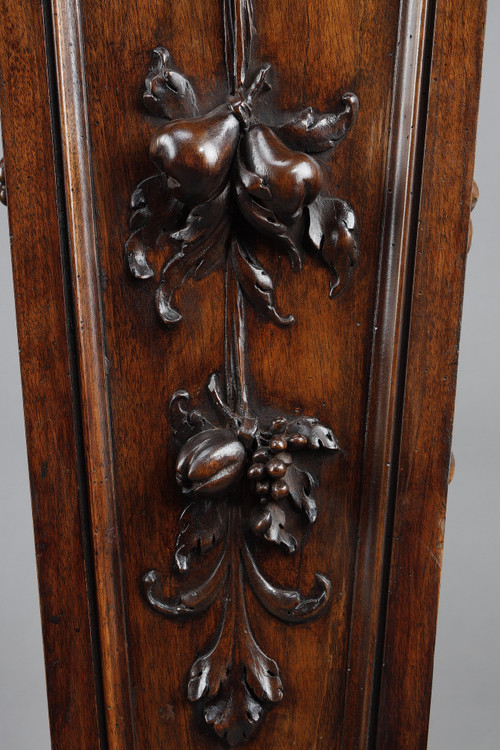 PAIR OF CARVED MOLDED WALNUT SELLETTES WITH FRUIT AND PLANT DECORATIONS