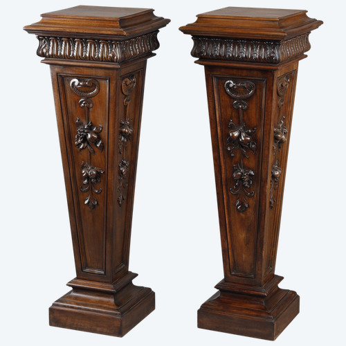 PAIR OF CARVED MOLDED WALNUT SELLETTES WITH FRUIT AND PLANT DECORATIONS