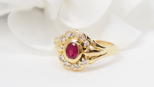 Yellow gold, ruby and diamond daisy ring