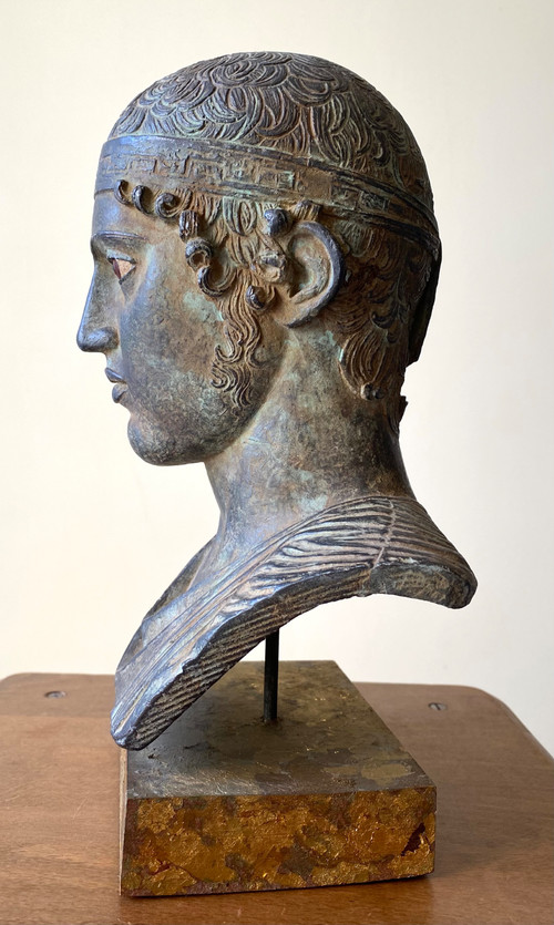 20th century patinated plaster sculpture. Head of a charioteer after the antique.