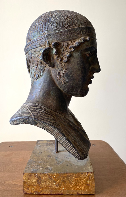 20th century patinated plaster sculpture. Head of a charioteer after the antique.