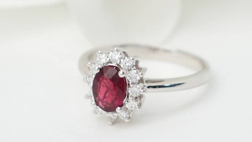 Surrounding ring in white gold, rubies and diamonds