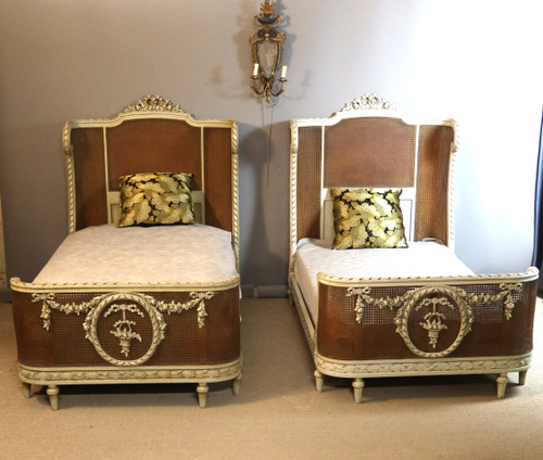 Pair of Louis XVI style caned beds