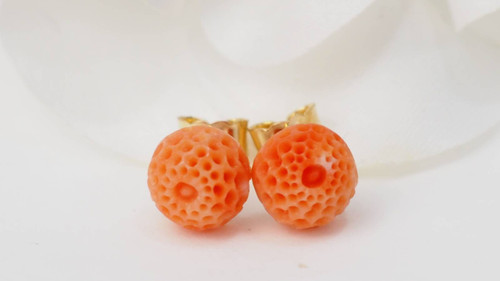 Carved coral and yellow gold earrings