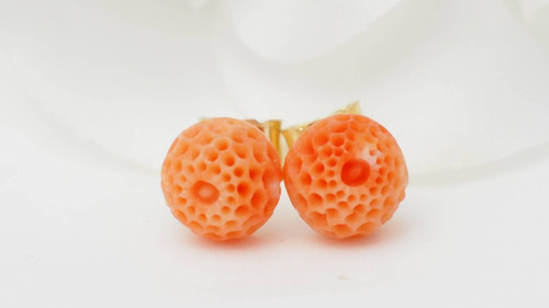 Carved coral and yellow gold earrings