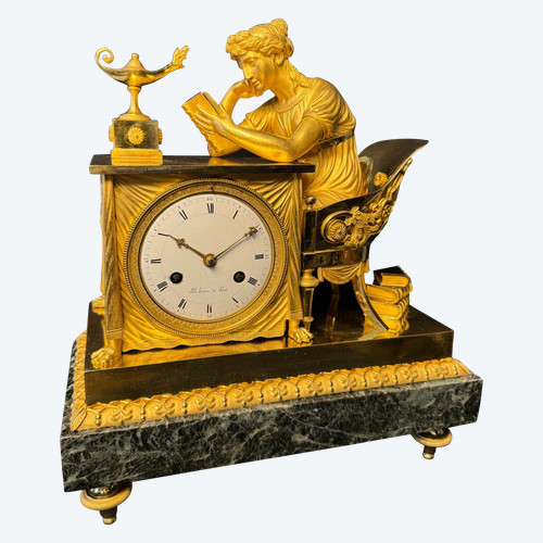 Clock "La Liseuse" in gilded bronze by J.A. Reiche, Empire period