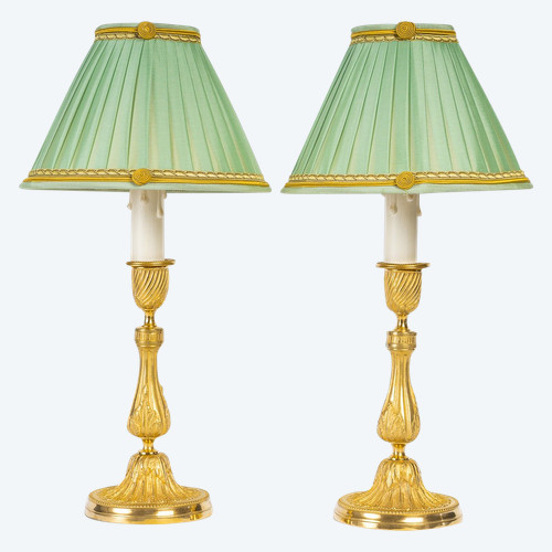 A pair of Louis XVI-style gilt bronze candlesticks circa 1820 converted as table lamps