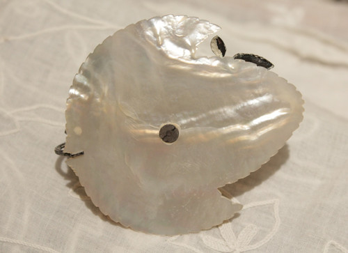 Small candlestick in sterling silver on mother-of-pearl leaf late 19th, early 20th century