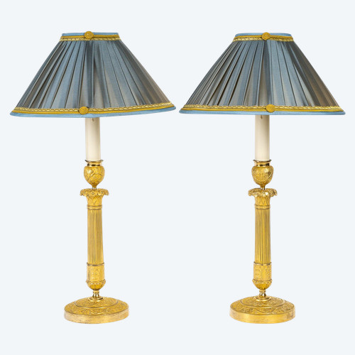 French Restoration period Pair of chiseled gilt bronze candlesticks mounted as lamps circa 1820