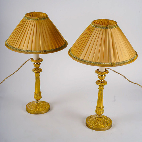 Coppia di torce in bronzo dorato e cesellato del periodo della Restaurazione montate come lampade 1820 ca.