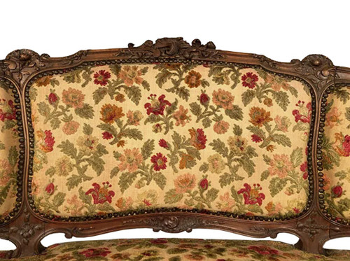 Small Rocaille-style sofa in richly carved walnut, 19th century