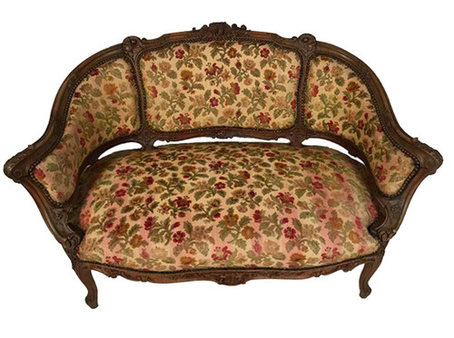 Small Rocaille-style sofa in richly carved walnut, 19th century