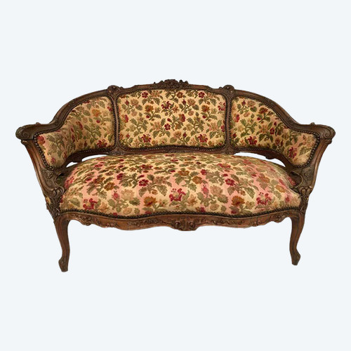 Small Rocaille-style sofa in richly carved walnut, 19th century