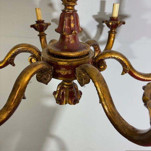 Antique Six Arm Chandelier 19th century era painted ruby and gold . All carved .