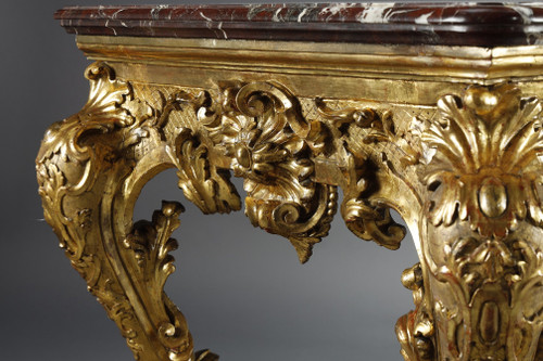 LARGE RECTANGULAR CONSOLE IN RICHLY CARVED AND GILDED WOOD