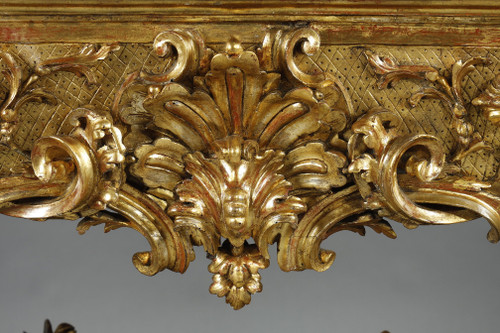 LARGE RECTANGULAR CONSOLE IN RICHLY CARVED AND GILDED WOOD