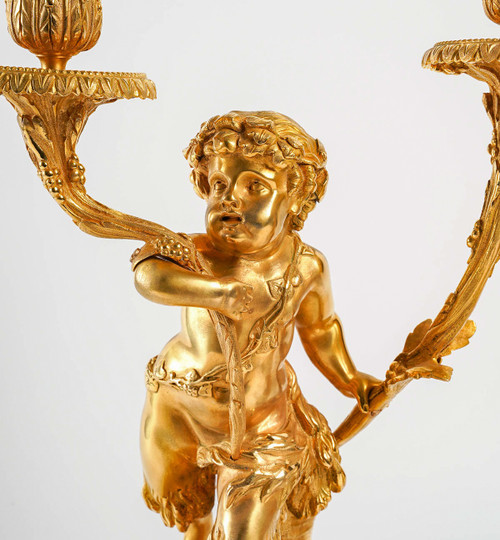 Coppia di candelabri Amour et Faune in bronzo dorato in stile Luigi XVI secondo Clodion e Delarue ver