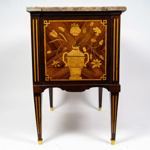 A commode Sauteuse with musical instruments marquetry, Louis XVI period circa 1780