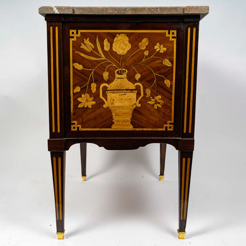 A commode Sauteuse with musical instruments marquetry, Louis XVI period circa 1780