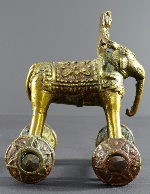 India, Early 20th Century, Bronze Cornac toy perched on an elephant.