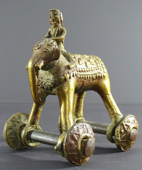 India, Early 20th Century, Bronze Cornac toy perched on an elephant.