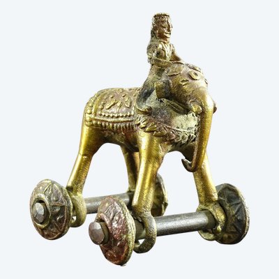 India, Early 20th Century, Bronze Cornac toy perched on an elephant.