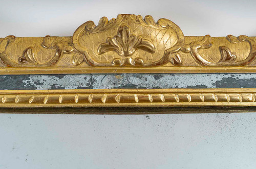 A French Regence period giltwood openwork pediment mirror circa 1720