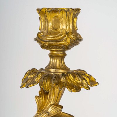 A pair of Napoleon III period gilt bronze Putti candlesticks, mounted as lamps