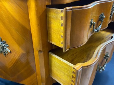 Large Louis XV-style bronze cherrywood commode with crossbow profile