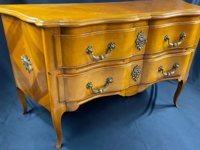 Large Louis XV-style bronze cherrywood commode with crossbow profile