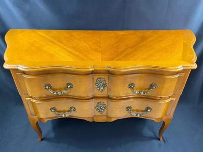 Large Louis XV-style bronze cherrywood commode with crossbow profile