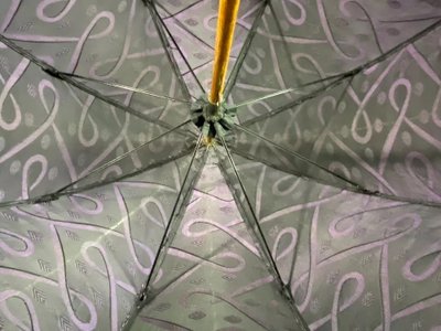 Large late 19th century parasol with carved mauve stone knob and possible gold ring