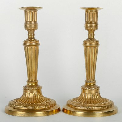 Pair of French Louis XVI period fluted gilt-bronze candlesticks mounted as table lamps circa 1780