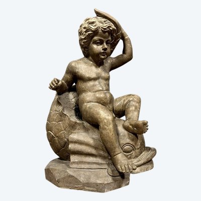 Italy, circa 1900: monumental marble statue of a Putto or cherub straddling a dolphin