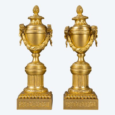 A pair of French Louis XVI period gilt bronze cassolettes forming candlesticks circa 1780