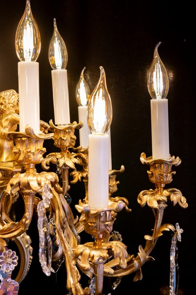 Signed by Victor Raulin (1867-1925), Louis XV style chiseled and gilded bronze chandelier Aux Amours