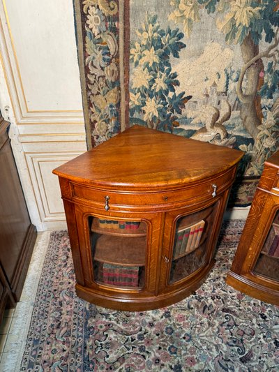 Pair of 19th century glass corner cabinets in blond oak